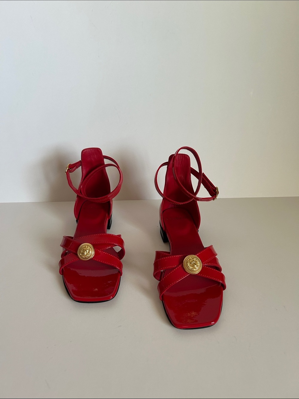 Balmain Red Patent Ankle-Strap Sandals with Gold Medallion